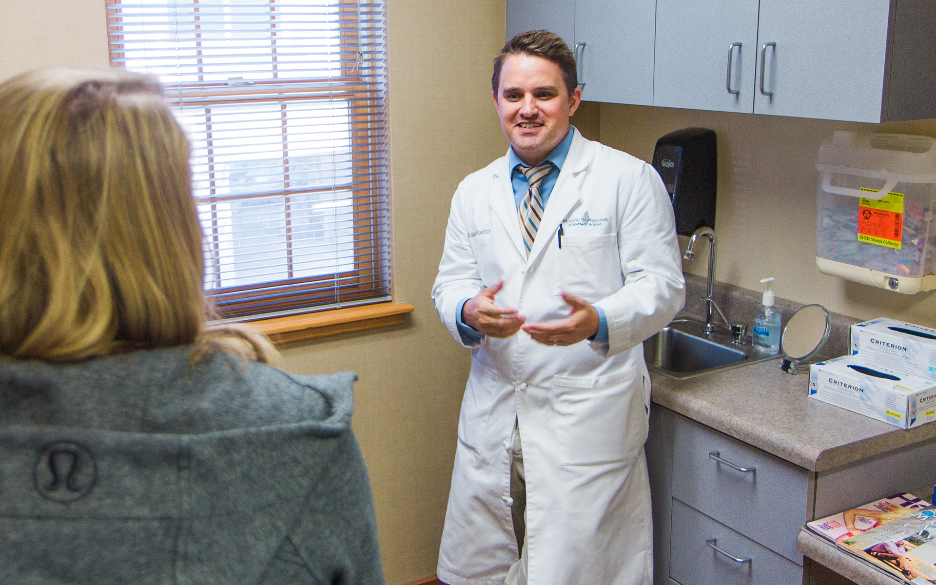 Doctor and patient during exam at Plastic Surgeons of Northern Arizona