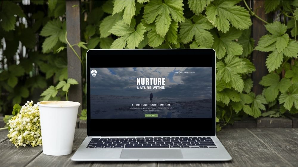 nurture nature within website displayed on a laptop outside 